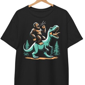 Funny Bigfoot Riding Dinosaur Shirt, Bigfoot Shirt, Big Foot Hiking Shirt, Cryptid T-Shirt, Yeti Sasquatch, Cool Graphic Tee, Gift for men