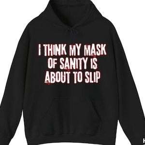May include: Black hooded sweatshirt with the text "I think my mask of sanity is about to slip" in red.