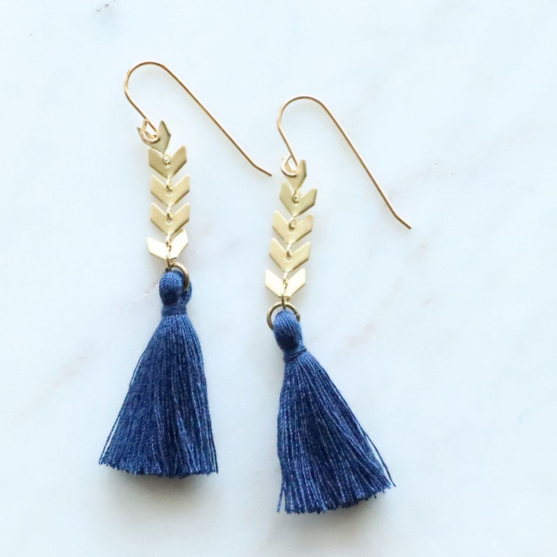 Navy Blue Tassels hang from about 3/4 of an inch of brushed gold chevron chain. Ear wires are natural brass. Lots of color choices available.