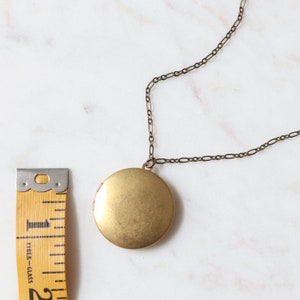 These vintage lockets are made of natural gold tone brass and hang on a long 32 inch chain. Because they are vintage some have minor