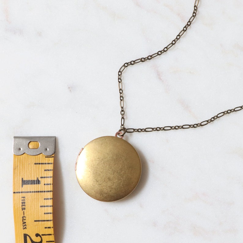 These vintage lockets are made of natural gold tone brass and hang on a long 32 inch chain. Because they are vintage some have minor