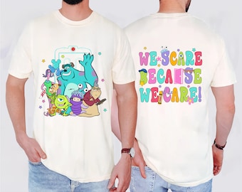 May include: A white t-shirt with a colorful graphic of characters from the movie Monsters Inc. on the front. The back of the shirt has the text "We scare because we care!" in colorful letters.
