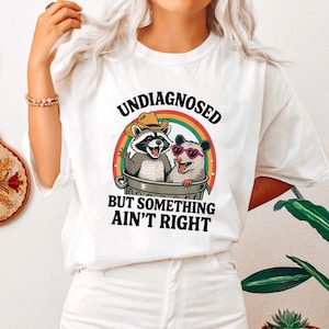 Undiagnosed But Something Aint Right Shirt, Raccoon Meme Shirt, Mental Health Shirt, Sarcastic Shirt, Funny Sayings Shirt, Trendy Shirt