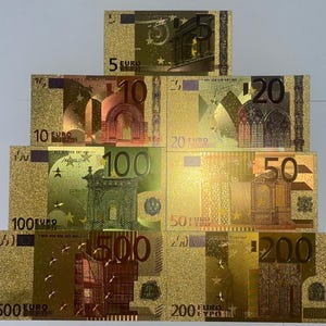 May include: A display of gold-coloured Euro banknotes, featuring denominations of 5, 10, 20, 50, 100, 200, and 500. Each note showcases intricate designs and the Euro symbol, with the value clearly visible.