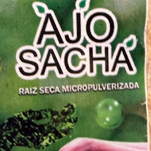 May include: A green and white package with the text "AJO SACHA" in black lettering. The text "RAIZ SECA MICRO PULVERIZADA" is also printed on the package.