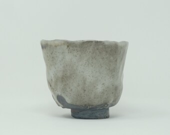 Wood Fired Dark Stoneware Kurinuki Guinomi Cup with a Shino Glaze