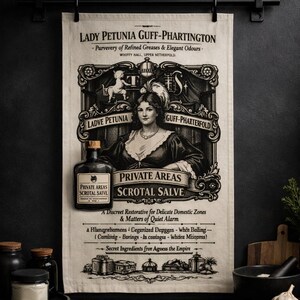 May include: A vintage-style wall hanging featuring a black and white advertisement for "Private Areas Scrotal Salve" by Lady Petunia Guff-Phartington. The design includes an illustration of a woman, a bottle of the salve, and decorative scrollwork.