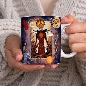 May include: White ceramic mug with a colorful illustration of Jack Skellington from The Nightmare Before Christmas. The illustration features Jack Skellington in a dark brown suit with a pumpkin in his hand. The background is a dark blue with orange and yellow accents.