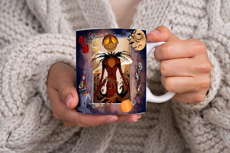May include: White ceramic mug with a colorful illustration of Jack Skellington from The Nightmare Before Christmas. The illustration features Jack Skellington in a dark brown suit with a pumpkin in his hand. The background is a dark blue with orange and yellow accents.