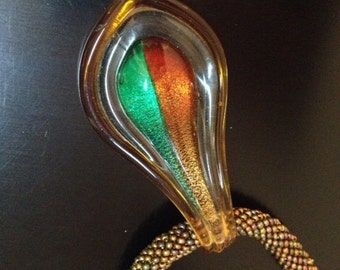 Crocheted  Necklace with handmade glass fused pendant in orange and green colors