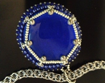 Royal blue glass pendant with metal chainmaille.