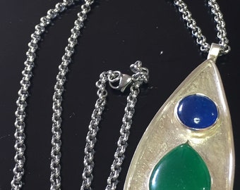 Green and blue beautiful silver pendant. Natural minerals gemstones inlaid in a teardrop pendant.