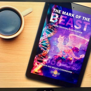 May include: A digital tablet displaying the book cover of "The Mark of the Beast" with a colorful illustration and the authors' names. A cup of coffee sits to the left on a wooden surface.
