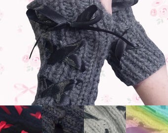 May include: Gray knitted fingerless gloves with black ribbon bows and lace-up details. The gloves are shown in different colors, including black, gray, and a rainbow gradient.