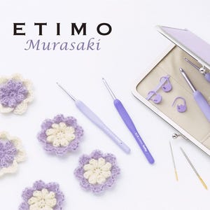 May include: A crochet set with lavender and silver crochet hooks, stitch markers, and needles, displayed in a lavender case. The image also shows several handmade crochet flowers in shades of lavender and cream. The text "ETIMO Murasaki" is at the top.