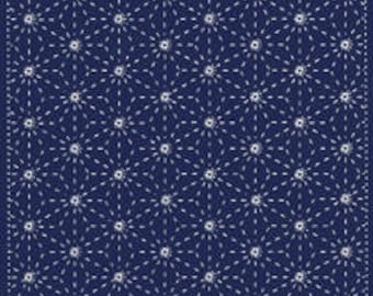 May include: A navy blue fabric with a white repeating pattern of small circles with radiating lines. The pattern is reminiscent of a traditional Japanese textile design.