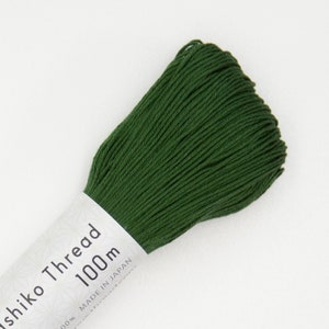 May include: A spool of dark green Shiko Thread, a 100% cotton embroidery thread, with a label that reads "Shiko Thread 100m Made in Japan".