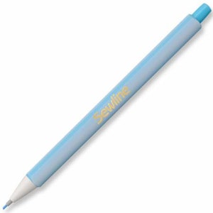 May include: A light blue sewing marking pencil with a white tip and a gold "Sewline" logo.