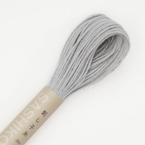 May include: A spool of light gray embroidery floss with the text "Sashiko 刺し子" and "20cm" printed on the label.