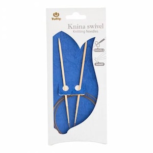 May include: A package of Tulip brand Knina Swivel Knitting Needles. The package is white with a blue tulip design and the words "Knina Swivel Knitting Needles" printed on it. The needles are made of wood and have a swivel tip.