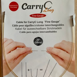 May include: A close-up of a beige knitting cable for interchangeable needles. The cable is 20 inches (50 cm) long and is labeled "CarryC Long Fine Gauge".