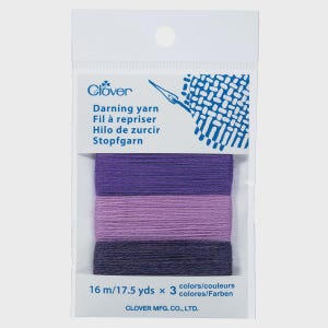 May include: A package of Clover darning yarn in shades of purple. The package includes three different shades of yarn, each wound into a small bundle. The package also includes the text "Darning yarn" and "16 m/17.5 yds x 3 colors".