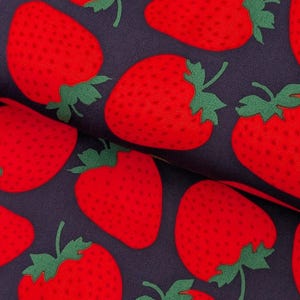 May include: A fabric featuring a repeating pattern of bright red strawberries with green leaves set against a dark navy blue background. The strawberries are depicted with small dark red dots representing seeds, creating a consistent graphic print.