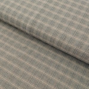 May include: Close-up of a fabric with a plaid pattern. The fabric has a light blue and beige color scheme, with a subtle texture. The plaid design is formed by intersecting lines, creating a grid-like appearance. The fabric is rolled up in the image.