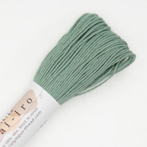 May include: A skein of light green cotton embroidery floss, labeled "ai-iro" and "100% 40m MADE IN JAPAN //olympus-thread.com".