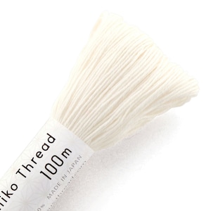 May include: A spool of white embroidery thread labeled "Sashiko Thread 1000m Made in Japan".