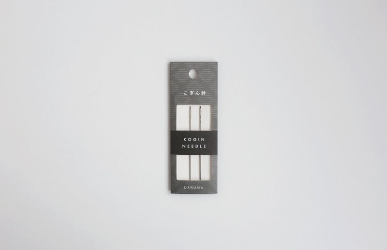 May include: A package of three silver KOGIN NEEDLE needles, labeled "KOGIN NEEDLE" and "DARUMA" on a gray background.