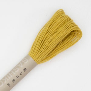 May include: A spool of yellow embroidery floss with a label that reads "Sashiko" and "20m" in Japanese.