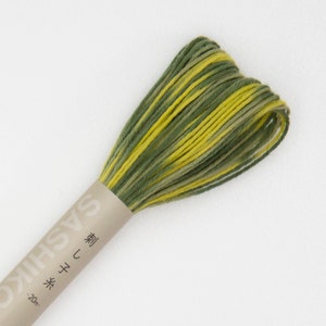 May include: A spool of green and yellow sashiko thread with the text "Sashiko  糸  刺し  型" on the label.