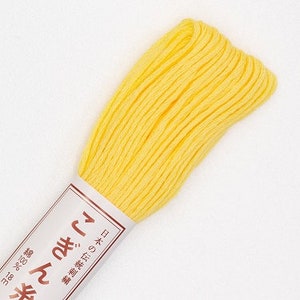 May include: A spool of bright yellow embroidery floss with the text "糸むし" in Japanese characters on the label.