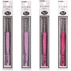 May include: Six different sizes of Tulip Etimo Rose crochet hooks in individual clear plastic packaging. The hooks are color-coded by size, with the smallest hook being pink and the largest hook being a darker pink. The packaging includes the size number and the corresponding size in millimeters.
