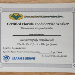 May include: A white certificate with a gray border, certifying Rosa Maria Keleher as a Florida Food Service Worker. The certificate is from Environ Health Associates, Inc. and states that the worker successfully completed the Florida Food Service Worker Course on 06/01/2024. The certificate is valid for 3 years from the date of completion. The certificate is from 360 Learn 2 Serve Training and is signed by Roy Costa, DBPR Provider: 2067825.