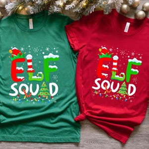 May include: Two Christmas-themed t-shirts, one green and one red, with the text "Elf Squad" and a cartoon elf wearing a hat and boots.