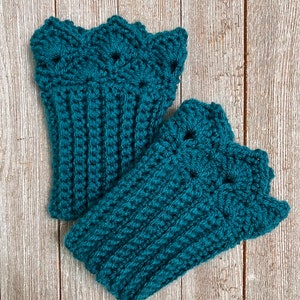 May include: A pair of teal blue crocheted fingerless gloves with a decorative scalloped edge.