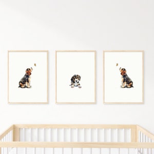 May include: Three watercolour paintings of a beagle puppy looking up at a butterfly. The puppy is brown, black, and white. The butterfly is yellow. The paintings are framed in natural wood.