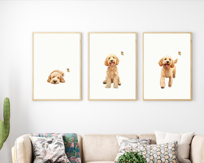 May include: Three framed prints of a golden doodle dog. The dog is shown in three different poses: sleeping, sitting, and running. Each print features a small butterfly.