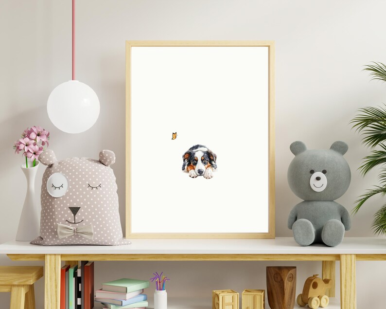 May include: A framed watercolor painting of a black, brown, and white puppy lying down and looking at the viewer. The puppy is in a white background with a small orange butterfly in the top left corner.
