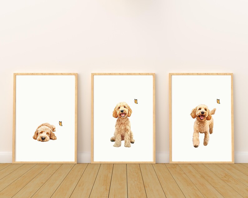 May include: Three framed prints of a golden doodle dog. The dog is shown in three different poses: lying down, sitting, and running. Each print features a small butterfly.