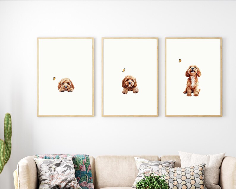 May include: Three framed prints of a brown and white dog with a butterfly. The dog is looking up in the first print, lying down in the second print, and sitting up in the third print.