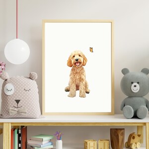 May include: A digital illustration of a golden doodle dog sitting and smiling with a butterfly flying above it. The illustration is framed and displayed on a shelf with other decor.