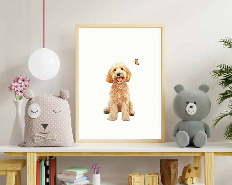 May include: A digital illustration of a golden doodle dog sitting and smiling with a butterfly flying above it. The illustration is framed and displayed on a shelf with other decor.