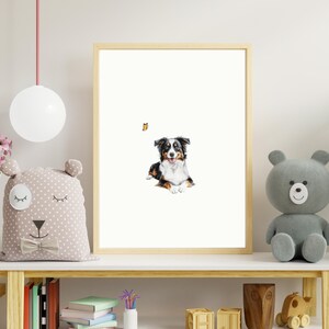 May include: A framed watercolor painting of a black and white Australian Shepherd dog with a butterfly flying above it. The dog is sitting on a white background.