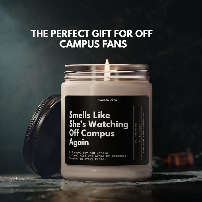 May include: A scented soy wax candle in a clear glass jar with a black lid. The label reads: THE PERFECT GIFT FOR OFF CAMPUS FANS, sweetwickco, Smells Like She&rsquo;s Watching Off Campus Again, A Scented Soy Wax Candle Infused With The Aroma Of Romantic Tension In Every Flame, Soy Wax Blend, 50-60 Hours.