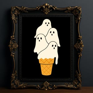 May include: A framed art print featuring a whimsical illustration of four white ghost figures stacked like ice cream on top of a waffle cone. The artwork is set against a black background and framed in a decorative black frame.