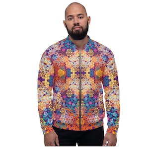 May include: A colourful bomber jacket with a geometric pattern in shades of orange, yellow, purple, and blue.