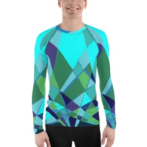 May include: A long-sleeved shirt with a geometric pattern in shades of blue, green, and purple. The shirt has a tight fit and is made of a stretchy material.